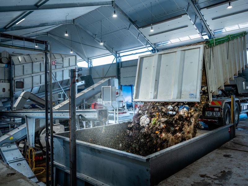 Garbage truck offloads food waste